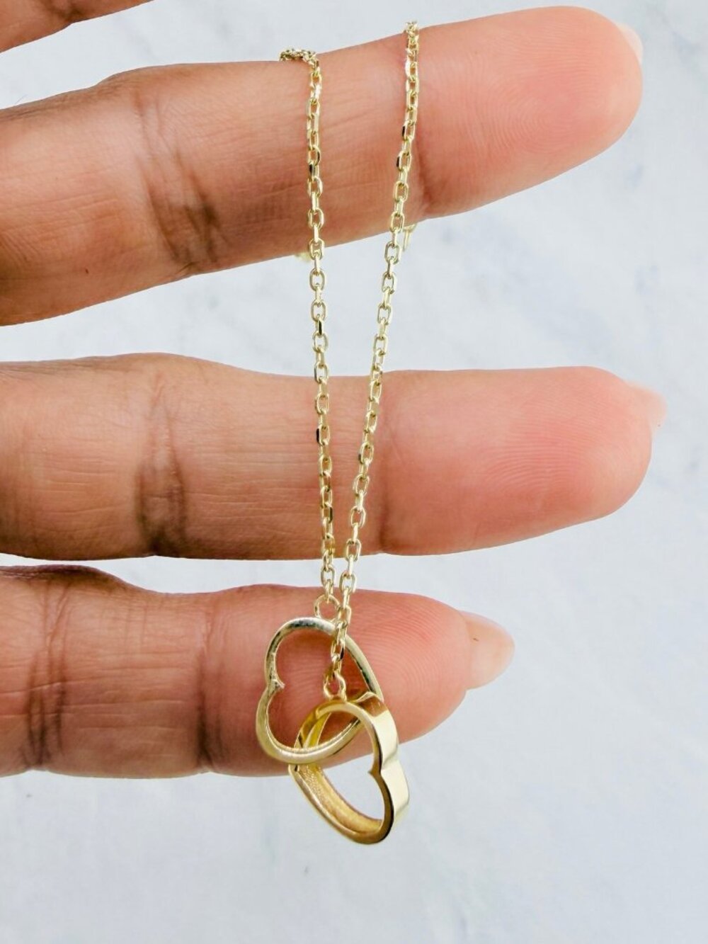10K gold bracelet features two intertwined hearts 7" - Picture 2 of 6